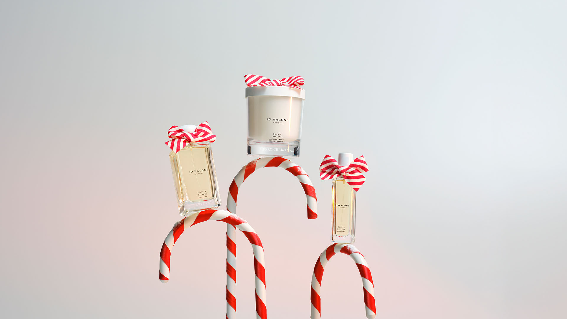 Jo Malone London Gingerbread House Candy Canes and boys running with gifts and ribbon